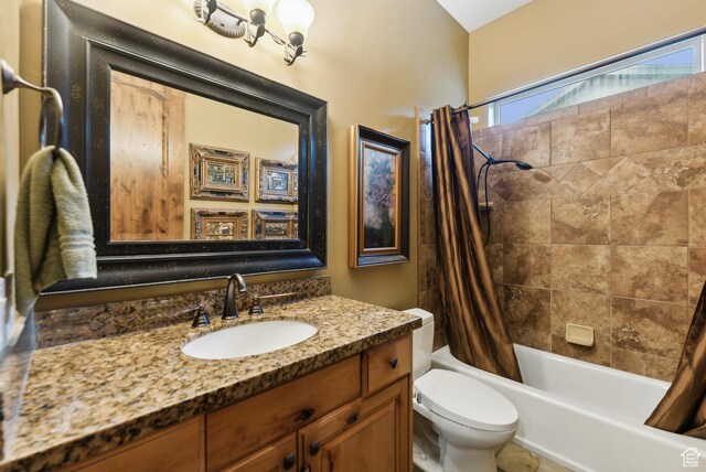 5964 S Ragsdale Dr E, Murray, UT 84121 - bathroom featuring shower / bath combination with curtain, toilet, and vanity