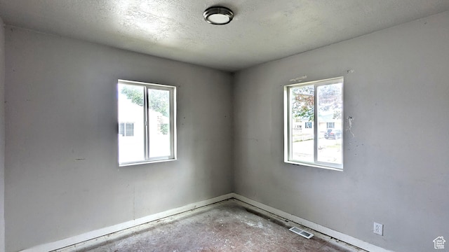 4650 W Mildred St, Kearns, UT 84118 - spare room with baseboards and a textured ceiling
