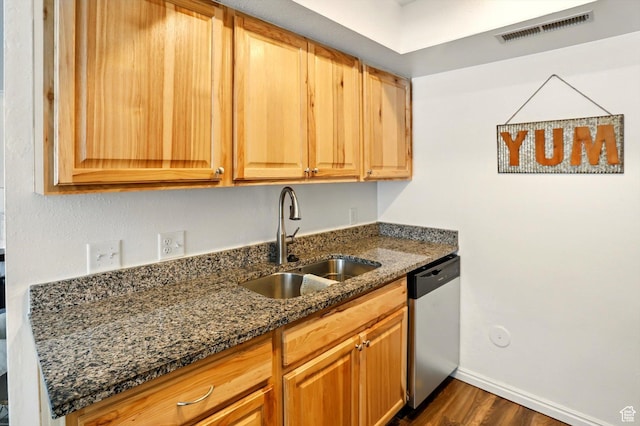875 E Arrowhead Ln S Unit 3, Murray, UT 84107 - kitchen featuring stainless steel dishwasher, a sink, dark wood-style flooring, dark stone countertops, and baseboards