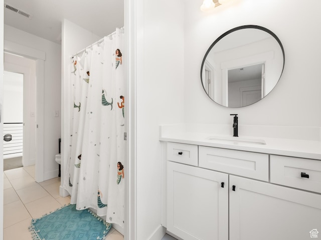 4823 N Canaan Peak Dr W, Eagle Mountain, UT 84005 - bathroom featuring vanity, tile patterned floors, toilet, and a shower with shower curtain