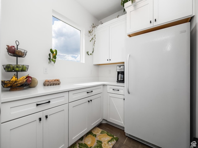 4823 N Canaan Peak Dr W, Eagle Mountain, UT 84005 - kitchen featuring freestanding refrigerator, white cabinets, light countertops, and dark wood-style floors