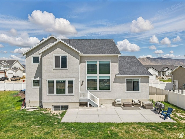 4823 N Canaan Peak Dr W, Eagle Mountain, UT 84005 - back of property with an outdoor hangout area, stucco siding, a patio, and roof with shingles