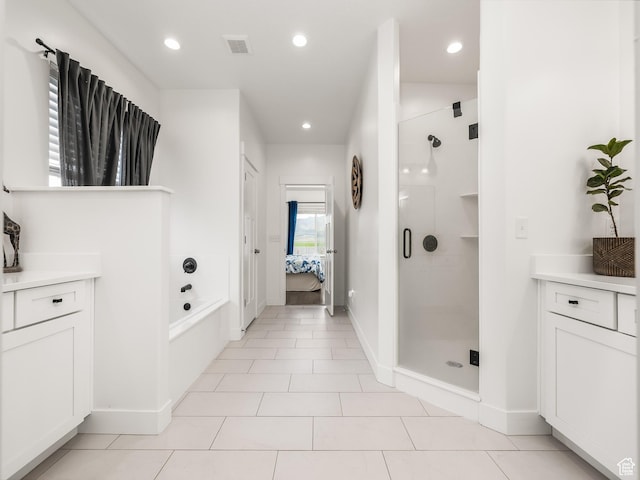 4823 N Canaan Peak Dr W, Eagle Mountain, UT 84005 - ensuite bathroom with a shower stall, a bath, vanity, recessed lighting, and baseboards