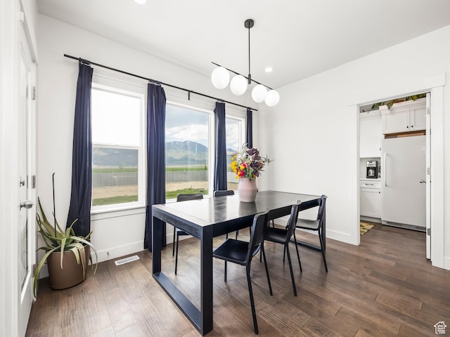 4823 N Canaan Peak Dr W, Eagle Mountain, UT 84005 - dining room with dark wood-style floors, recessed lighting, and baseboards