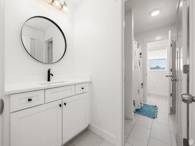 4823 N Canaan Peak Dr W, Eagle Mountain, UT 84005 - bathroom with vanity, baseboards, and tile patterned floors