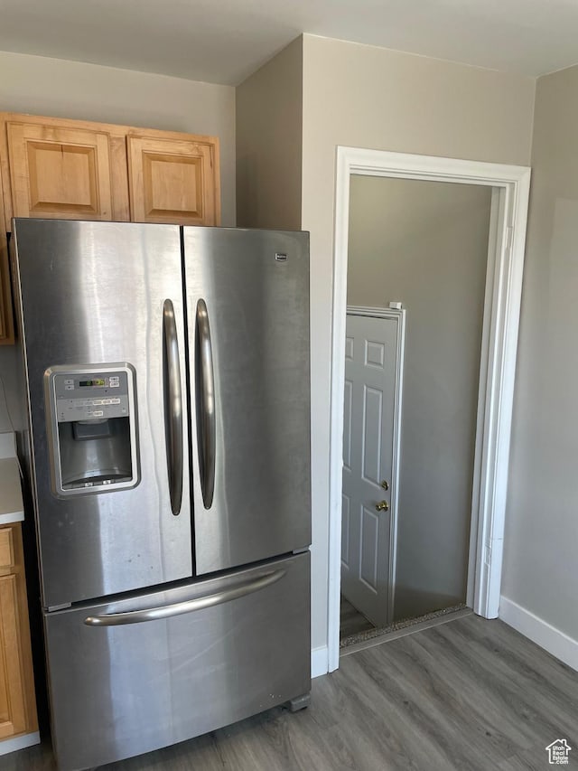 197 Ross Dr Lot 6, Clearfield, UT 84015 - kitchen view of stainless steel refrigerator with ice dispenser, wood finished floors, baseboards, and light brown cabinetry