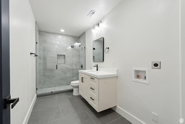 11603 S Fox Vista Dr, Draper, UT 84020 - bathroom featuring vanity, baseboards, toilet, a stall shower, and recessed lighting
