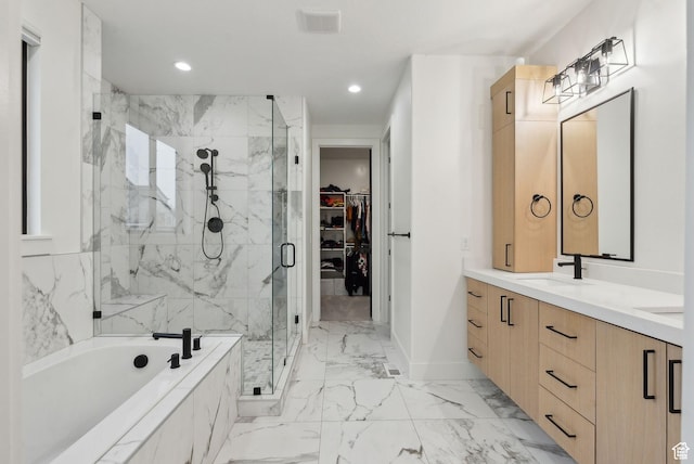 11603 S Fox Vista Dr, Draper, UT 84020 - bathroom featuring a marble finish shower, a garden tub, double vanity, marble finish flooring, and a spacious closet