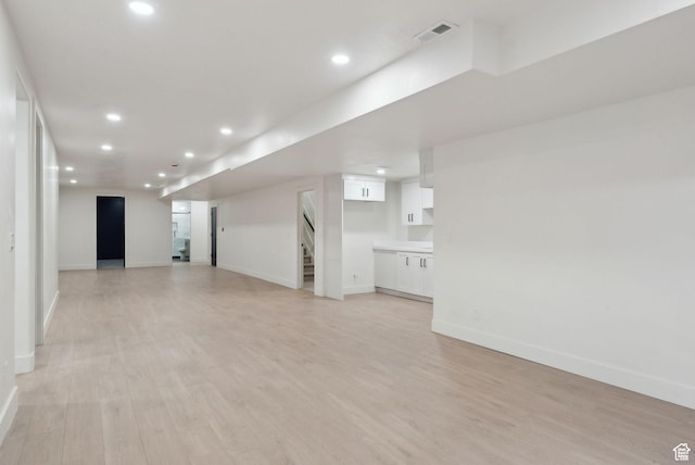 11603 S Fox Vista Dr, Draper, UT 84020 - unfurnished living room featuring baseboards, stairway, recessed lighting, and light wood-style floors