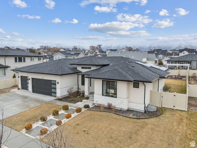 11603 S Fox Vista Dr, Draper, UT 84020 - prairie-style home with a gate, a shingled roof, a residential view, an attached garage, and stone siding