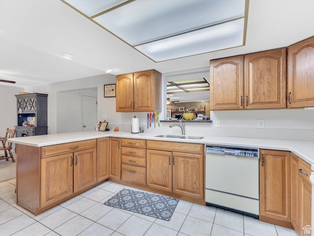 5104 Shawnee Ln, Ogden, UT 84403 - kitchen with white dishwasher, a sink, a peninsula, light countertops, and light tile patterned floors