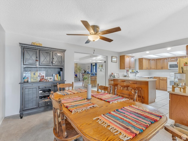 5104 Shawnee Ln, Ogden, UT 84403 - dining room featuring ceiling fan, a textured ceiling, recessed lighting, and light carpet