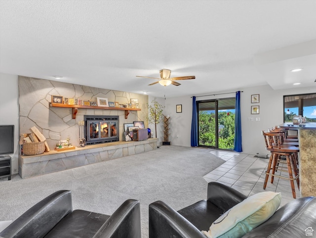 5104 Shawnee Ln, Ogden, UT 84403 - tiled living room with plenty of natural light, a tiled fireplace, a ceiling fan, and recessed lighting