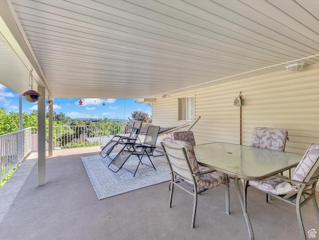 5104 Shawnee Ln, Ogden, UT 84403 - view of patio featuring outdoor dining space and a balcony