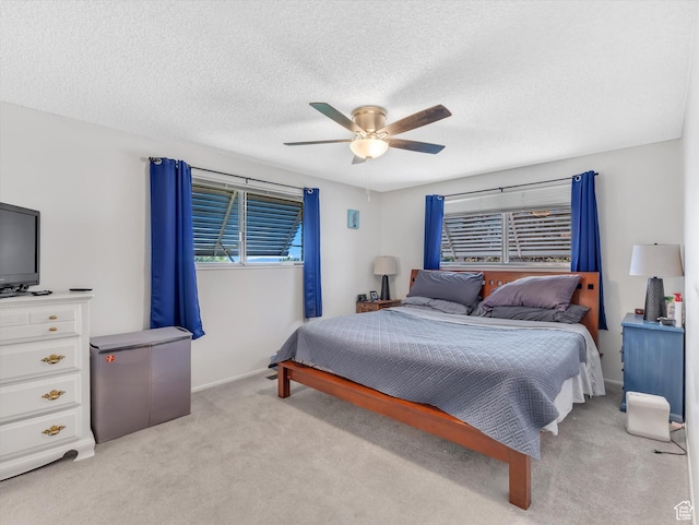5104 Shawnee Ln, Ogden, UT 84403 - bedroom featuring light carpet, ceiling fan, a textured ceiling, and baseboards