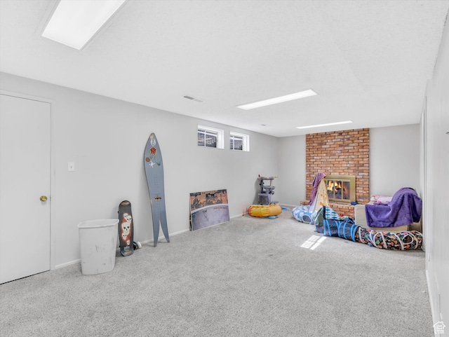 5104 Shawnee Ln, Ogden, UT 84403 - rec room featuring carpet, a brick fireplace, and baseboards