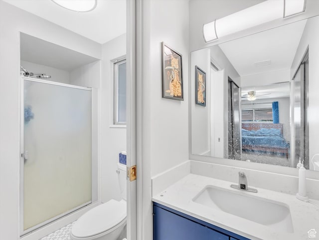 5104 Shawnee Ln, Ogden, UT 84403 - bathroom with a stall shower, vanity, toilet, and a ceiling fan