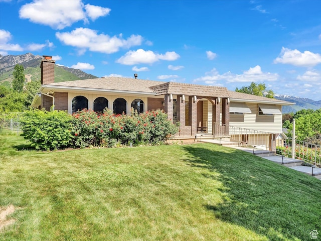 5104 Shawnee Ln, Ogden, UT 84403 - rear view of house featuring a chimney and a mountain view