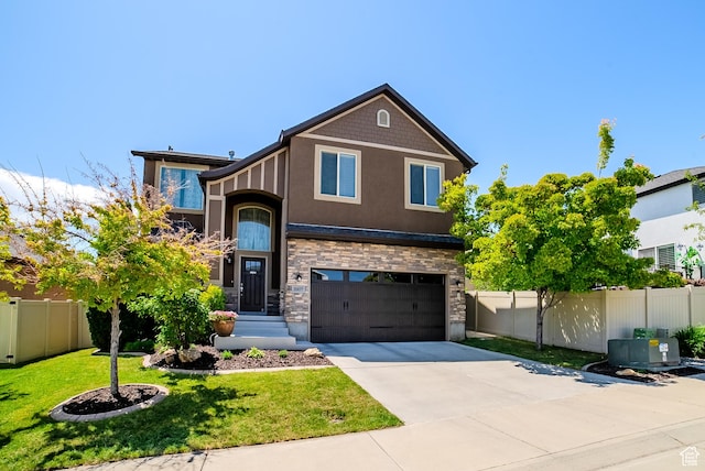 3907 W Tottori Dune Dr S, South Jordan, UT 84095 - view of front of house with an attached garage, driveway, stucco siding, and stone siding