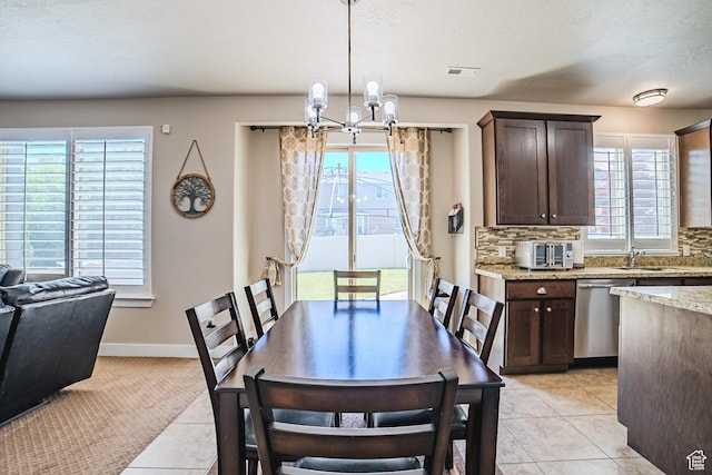 3907 W Tottori Dune Dr S, South Jordan, UT 84095 - dining area with a chandelier, light tile patterned floors, and baseboards