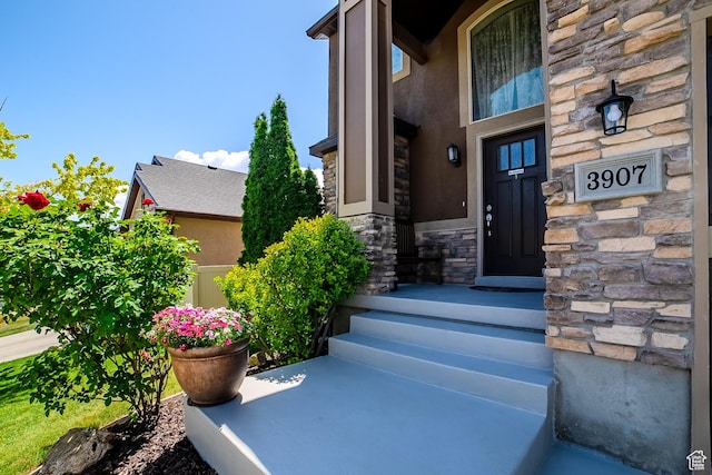 3907 W Tottori Dune Dr S, South Jordan, UT 84095 - doorway to property with stone siding and stucco siding