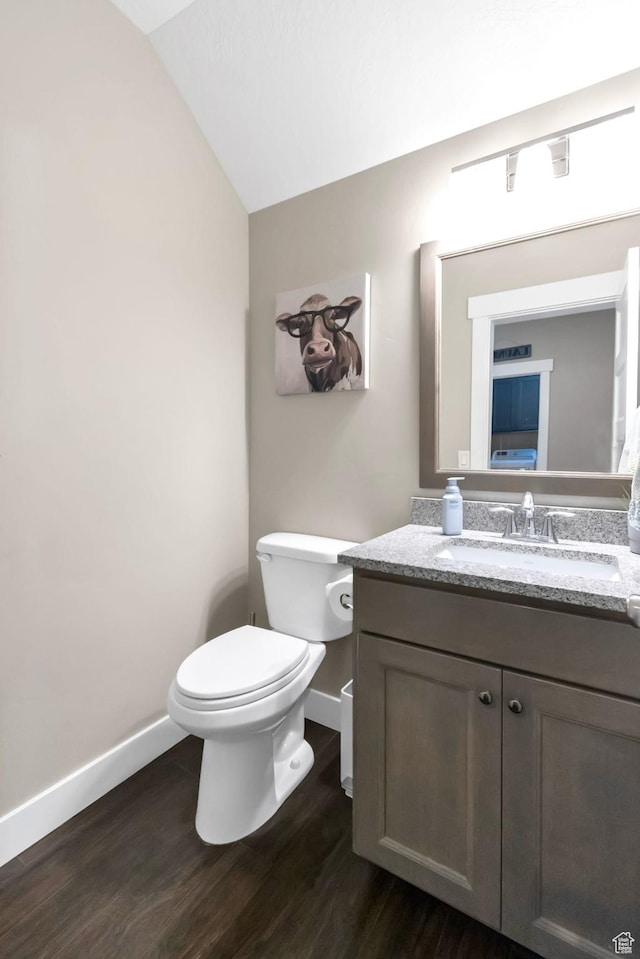 495 E 100 S, Centerfield, UT 84622 - bathroom featuring baseboards, vanity, wood finished floors, toilet, and lofted ceiling