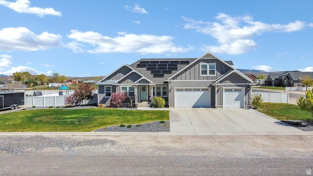 495 E 100 S, Centerfield, UT 84622 - craftsman house featuring board and batten siding, roof mounted solar panels, an attached garage, and concrete driveway