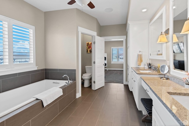 495 E 100 S, Centerfield, UT 84622 - full bathroom with toilet, a ceiling fan, vanity, a garden tub, and baseboards