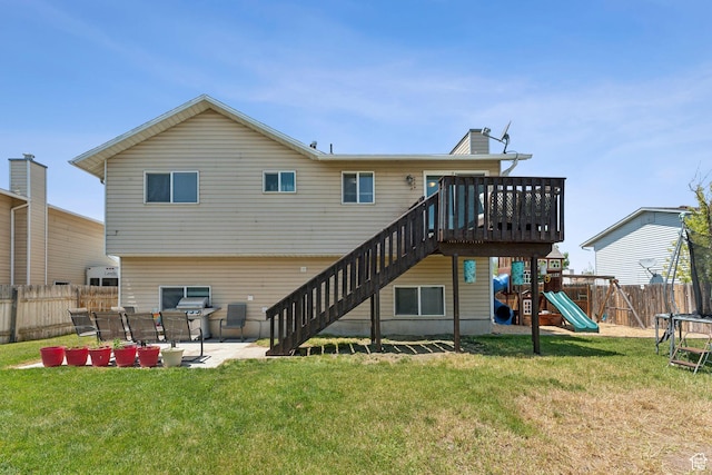 5748 S 3975 W, Roy, UT 84067 - back of property with a patio, stairs, a playground, and a trampoline