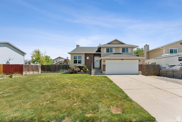 5748 S 3975 W, Roy, UT 84067 - split level home with concrete driveway, brick siding, and a garage