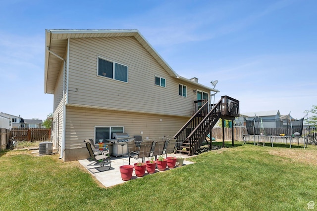 5748 S 3975 W, Roy, UT 84067 - rear view of property with a trampoline, central AC, stairs, a wooden deck, and a patio area