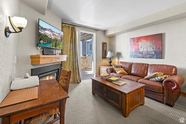 2669 Canyons Resort Dr Unit 304A, Park City, UT 84098 - living area featuring a glass covered fireplace and a textured wall