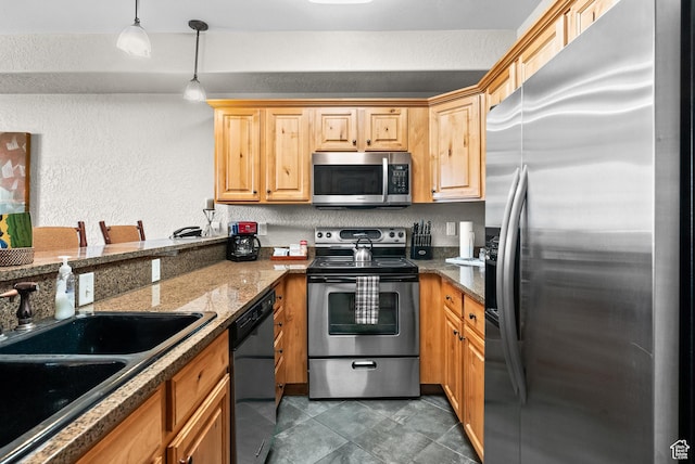 2669 Canyons Resort Dr Unit 304A, Park City, UT 84098 - kitchen with appliances with stainless steel finishes, a sink, a textured wall, pendant lighting, and dark stone counters