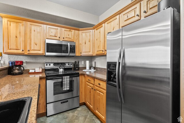 2669 Canyons Resort Dr Unit 304A, Park City, UT 84098 - kitchen featuring appliances with stainless steel finishes, a sink, and stone countertops