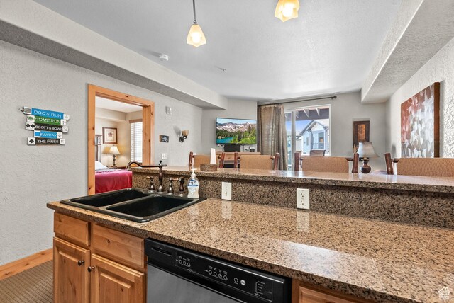 2669 Canyons Resort Dr Unit 304A, Park City, UT 84098 - kitchen with dishwasher, a sink, a textured wall, open floor plan, and light stone counters