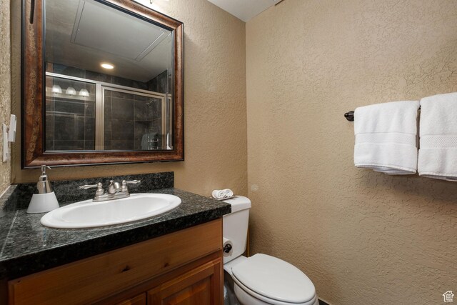 2669 Canyons Resort Dr Unit 304A, Park City, UT 84098 - bathroom with toilet, a textured wall, vanity, and a tile shower