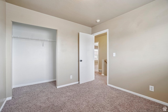 802 E 580 N, Tooele, UT 84074 - unfurnished bedroom featuring carpet flooring, baseboards, and a closet