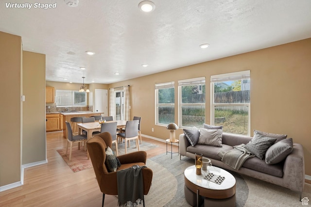 802 E 580 N, Tooele, UT 84074 - living area with light wood-type flooring, baseboards, and recessed lighting