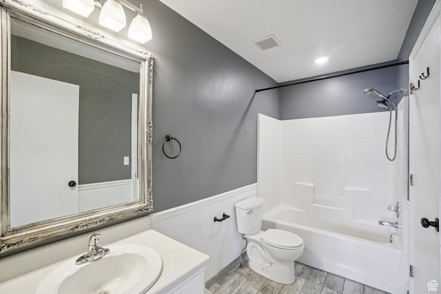 802 E 580 N, Tooele, UT 84074 - bathroom with toilet, vanity, bathtub / shower combination, and wood finished floors