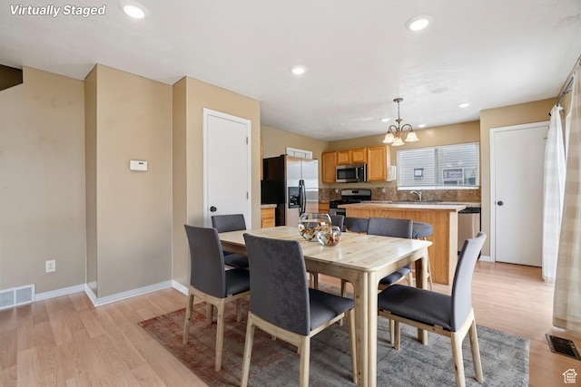 802 E 580 N, Tooele, UT 84074 - dining room with a chandelier, light wood-style flooring, recessed lighting, and baseboards