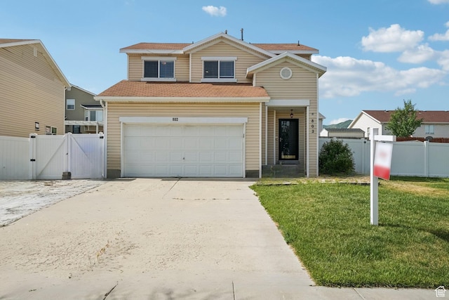 802 E 580 N, Tooele, UT 84074 - traditional-style home with a gate, concrete driveway, an attached garage, and a shingled roof