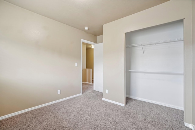 802 E 580 N, Tooele, UT 84074 - unfurnished bedroom featuring carpet floors, baseboards, and a closet