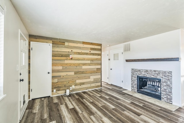5230 S 5200 W, Kearns, UT 84118 - unfurnished living room with wood finished floors, a fireplace, and wood walls