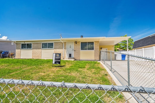 5230 S 5200 W, Kearns, UT 84118 - ranch-style home with brick siding, a carport, and driveway