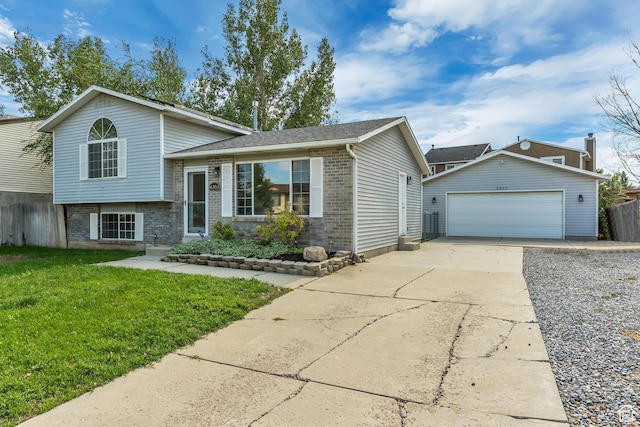 6353 W 3100 S, West Valley City, UT 84128 - split level home with a garage, an outbuilding, and brick siding