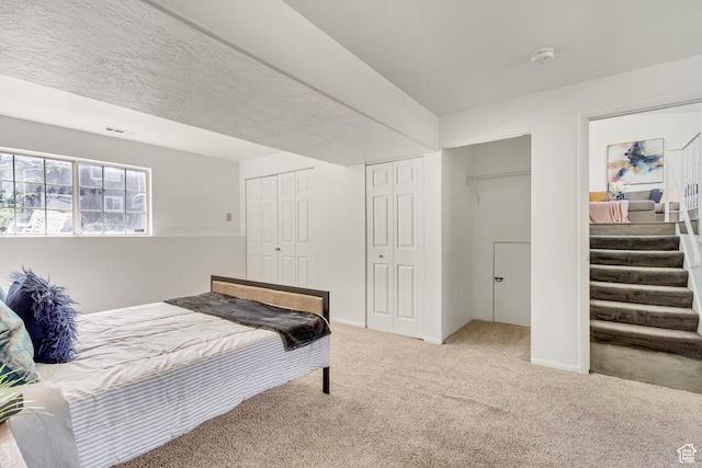 6353 W 3100 S, West Valley City, UT 84128 - bedroom featuring carpet and two closets