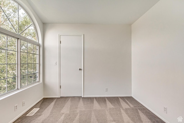 6353 W 3100 S, West Valley City, UT 84128 - spare room featuring plenty of natural light, baseboards, and carpet