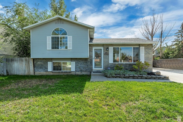6353 W 3100 S, West Valley City, UT 84128 - split level home featuring brick siding