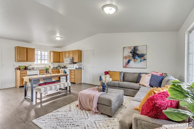 6353 W 3100 S, West Valley City, UT 84128 - living room with lofted ceiling, light wood-type flooring, and baseboards