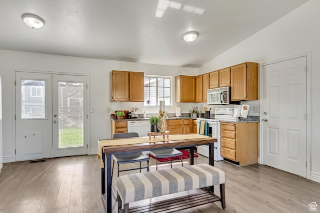 6353 W 3100 S, West Valley City, UT 84128 - kitchen with white appliances, vaulted ceiling, light wood-style floors, and brown cabinets